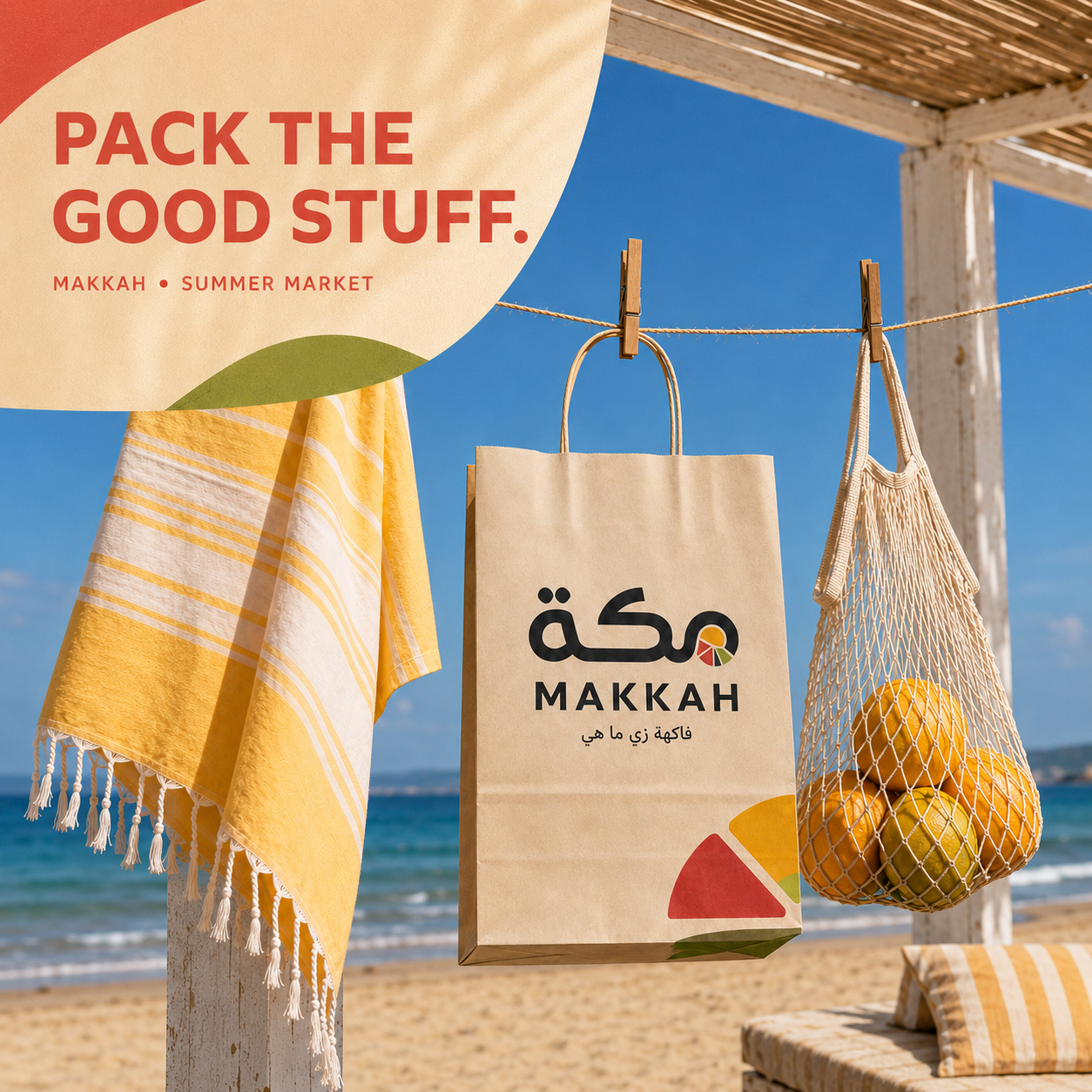 MAKKAH summer market carrier — branded paper bag and mesh tote at a beachside stall